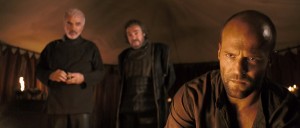 King Konreid (Burt Reynolds), Merick (John Rhys-Davies), and Farmer (Jason Stratham) convene a council before the upcoming battle with the krug.